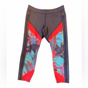 Under Armour Black Leggings with Red & Teal Geo Panels